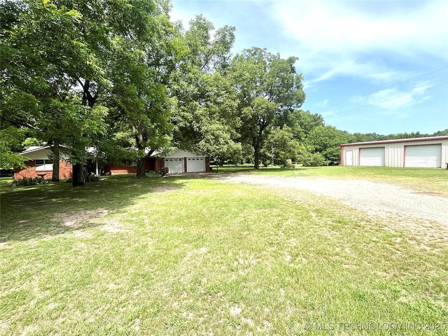 Full view of home with shop building