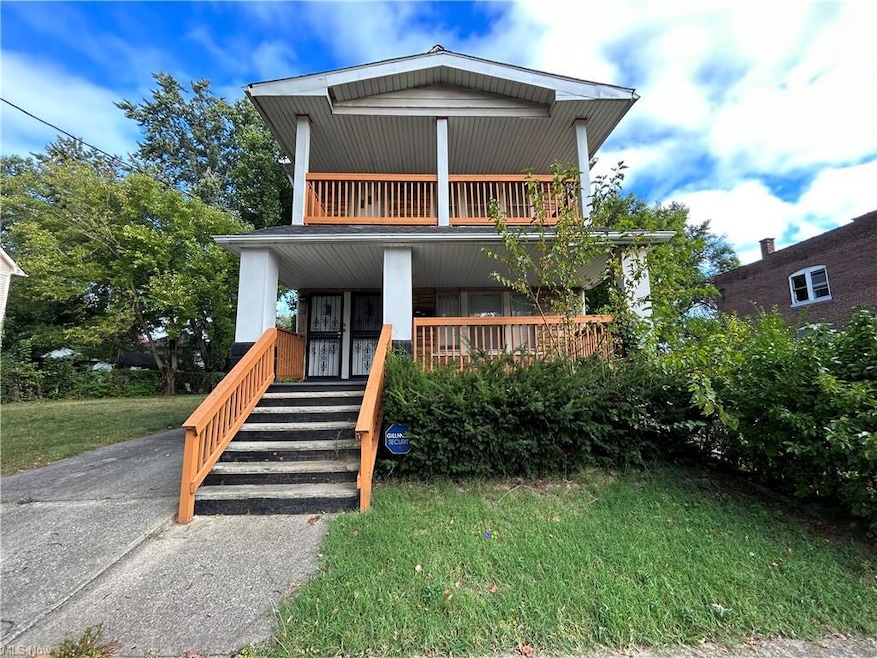 View of front of property with a front lawn and a porch