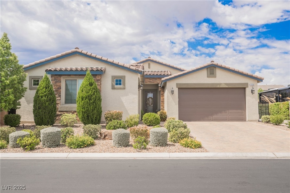 Mediterranean / spanish-style home with stucco siding, decorative driveway, a tile roof, and an attached garage