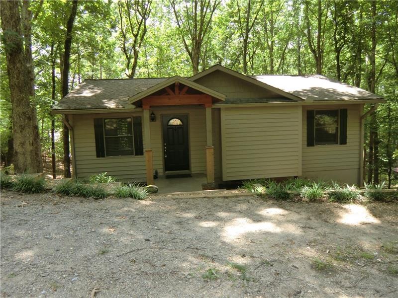 Covered Front Entry With Level Parking Pad.