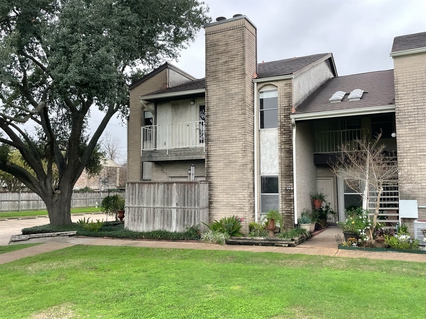Secluded second floor corner unit with tree covera