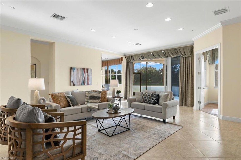 Tiled living room featuring ornamental molding
