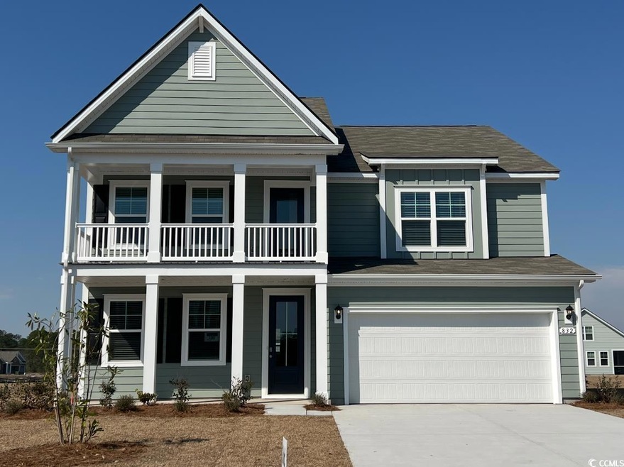 View of front of home featuring covered porch, con