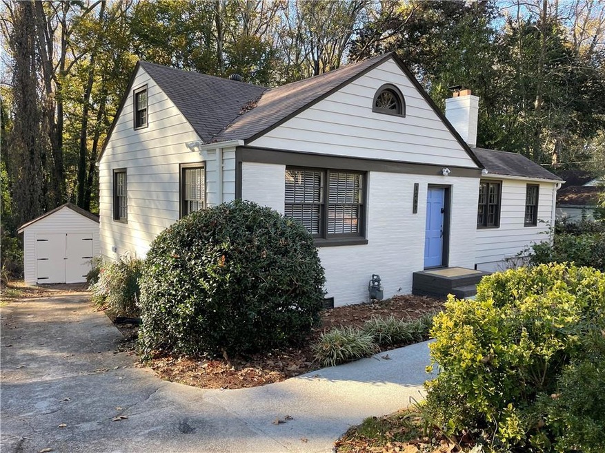View of front of home with a storage shed