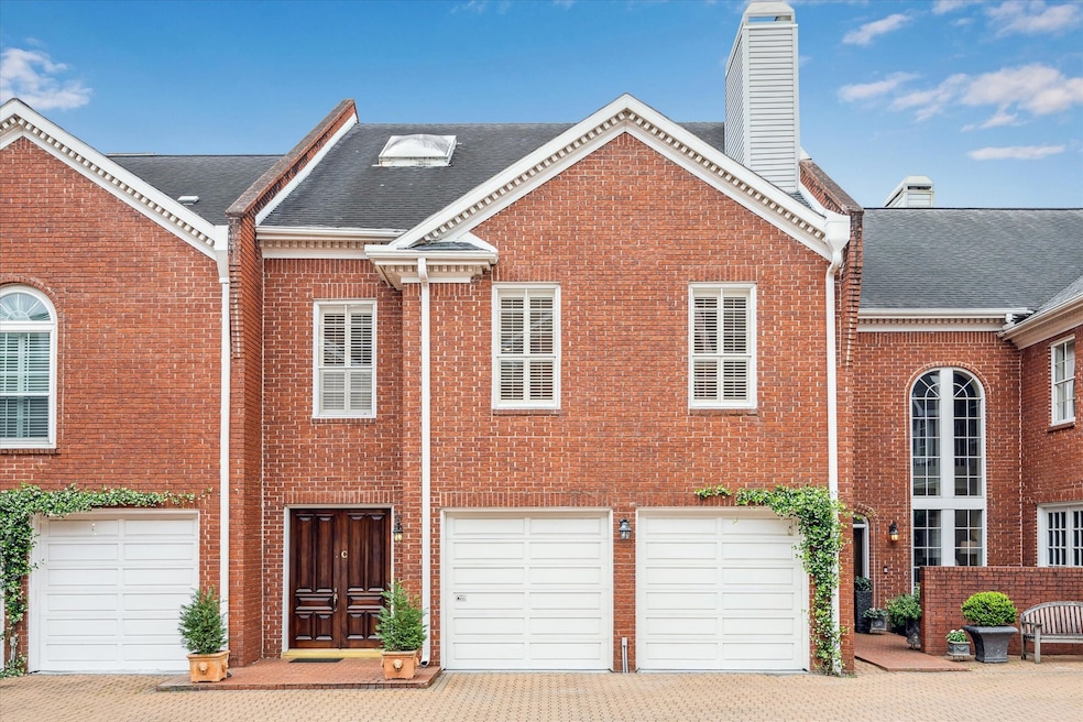 Nestled within a gated community shaded by mature