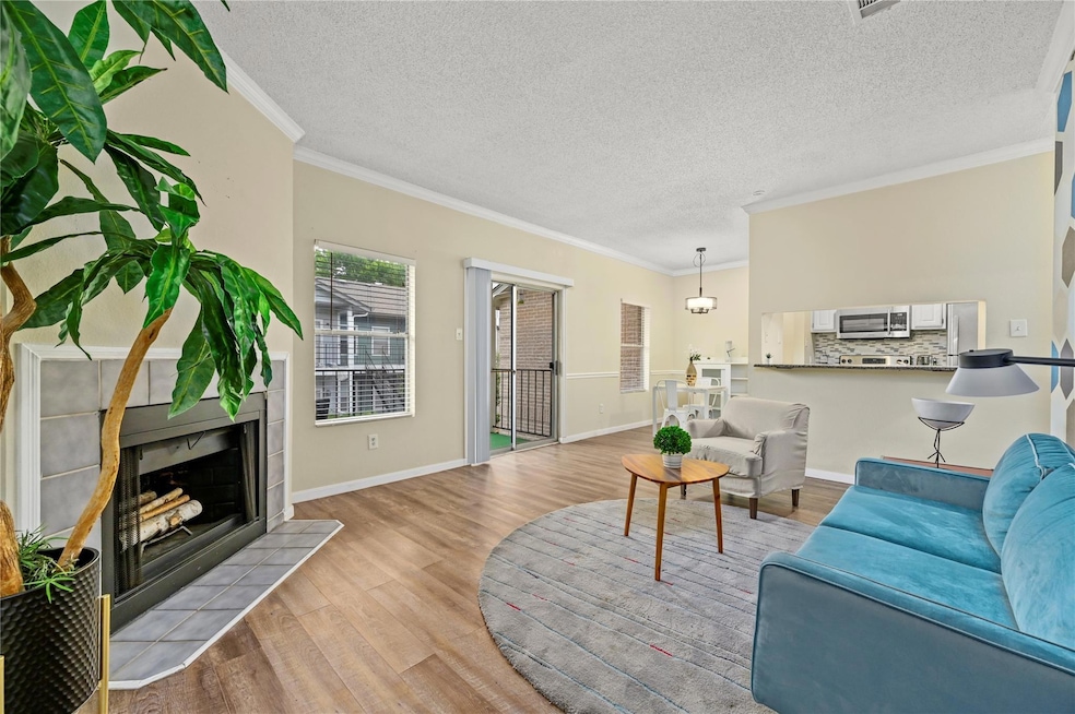Living room with light wood-style floors, ornamen