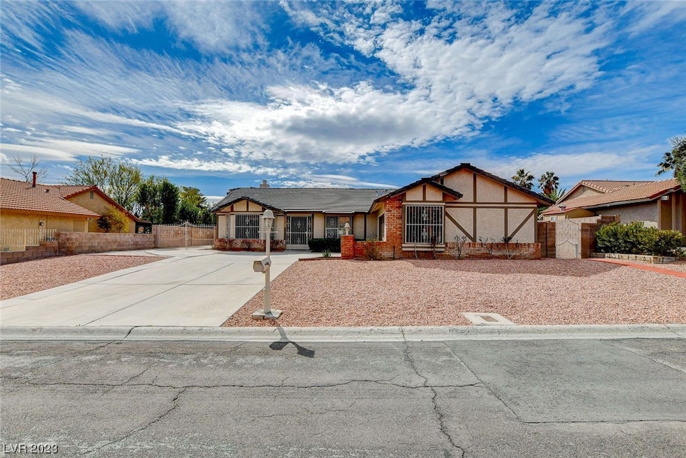 Low maintenance front yard has mature rose bushes,