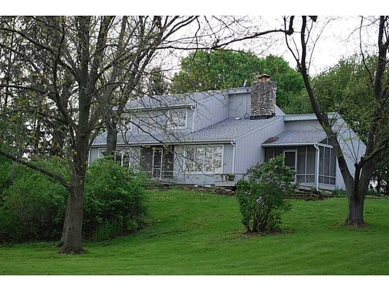Exterior Front. Enjoy sipping morning coffee on one of the decks overlooking the sprawling lawn and mature trees.