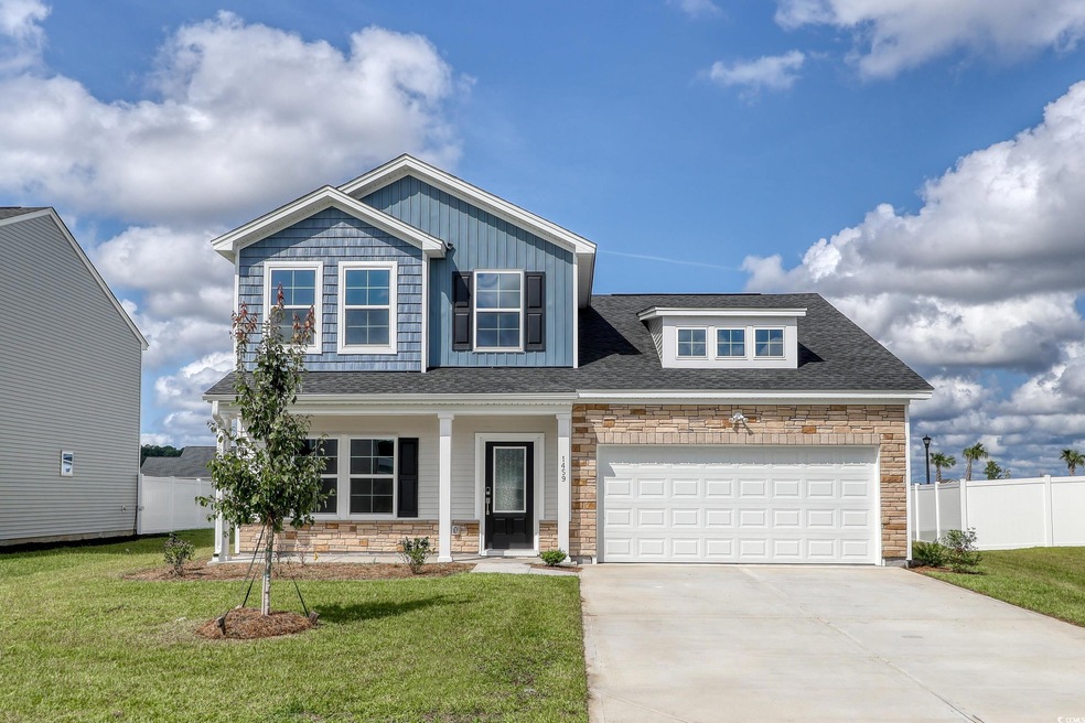 View of front of property with a front yard and a 