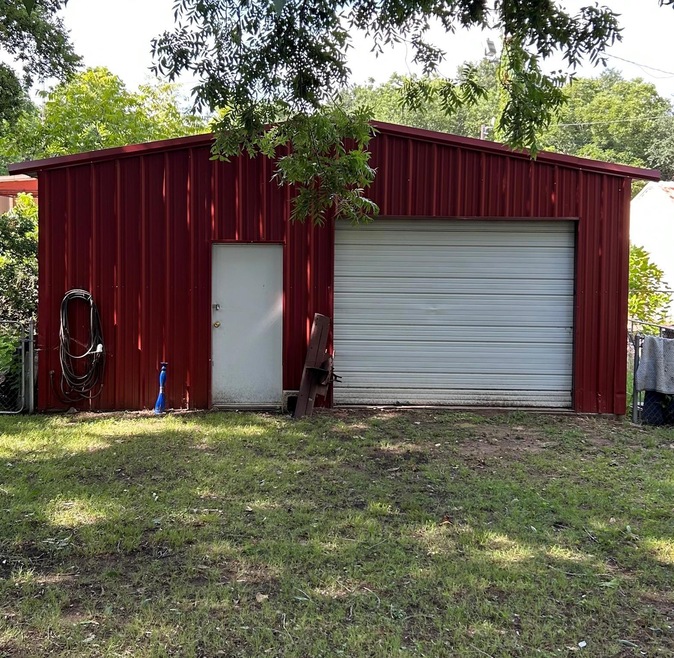 Garage with a lawn