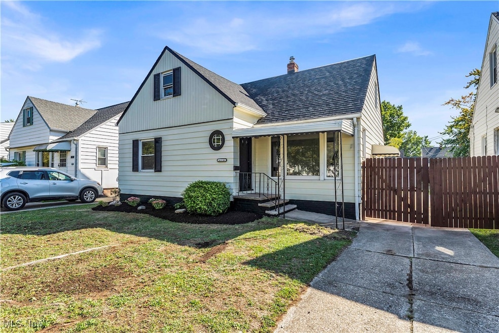 Bungalow with a shingled roof, a chimney, and a gate