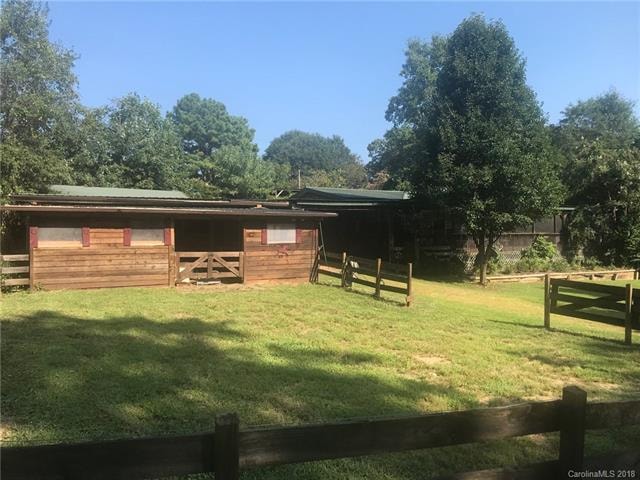 peaceful and serene with horse barn and fenced pad