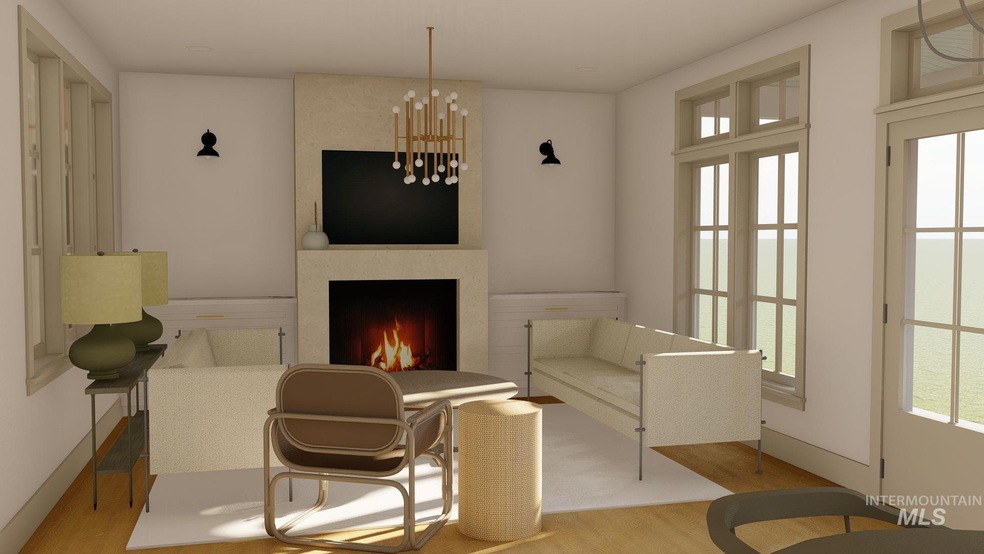 Living area with wood finished floors, a large fireplace, and a chandelier