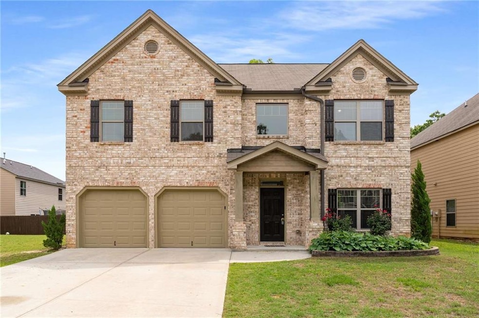 View of front of house with an attached garage, dr