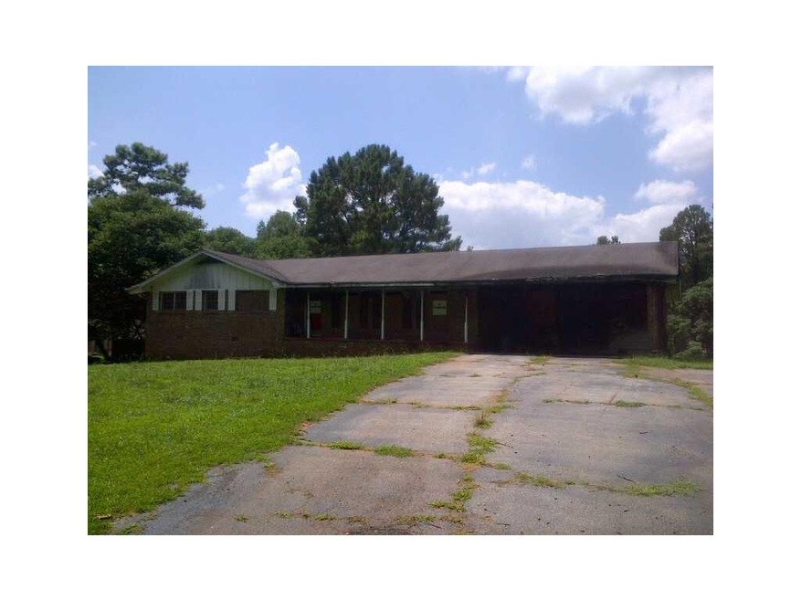 Exterior Front. Solid ranch with long inviting dri