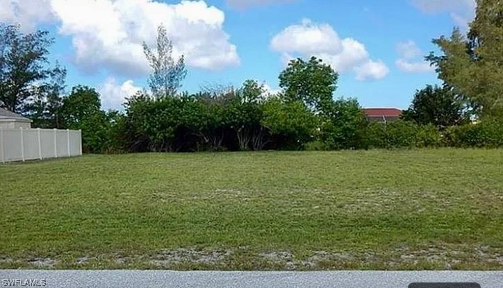 Lot is to the right of 1026 NW 20th and across fro