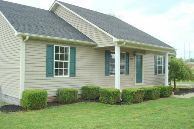 Front view from side showing landscaping.
