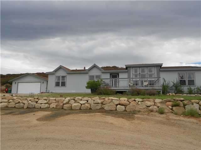 BEAUTIFUL HOME ON 11.970 ACRES WITH VIEWS OF THE V