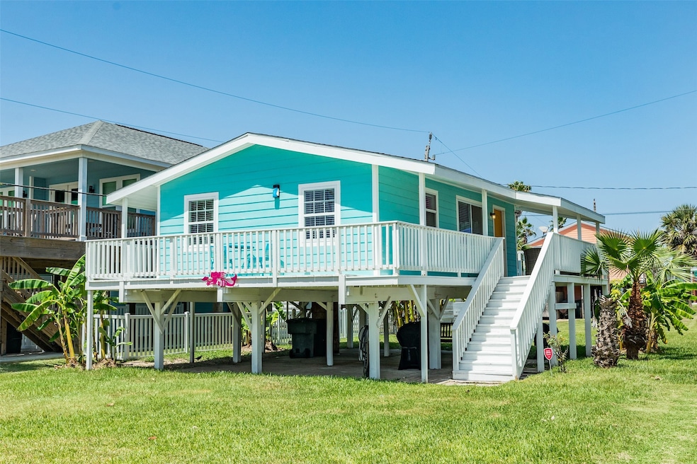This charming elevated beach house features a vibr
