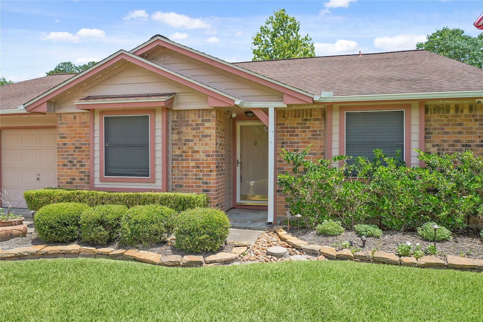Come see this charming single-story brick home wit