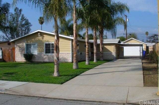 FRONT HOUSE SEVERAL PALM TREES ON FRONT & BACK YAR