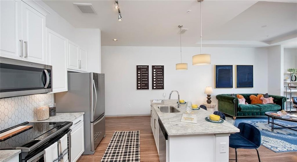 Kitchen featuring light hardwood / wood-style floo