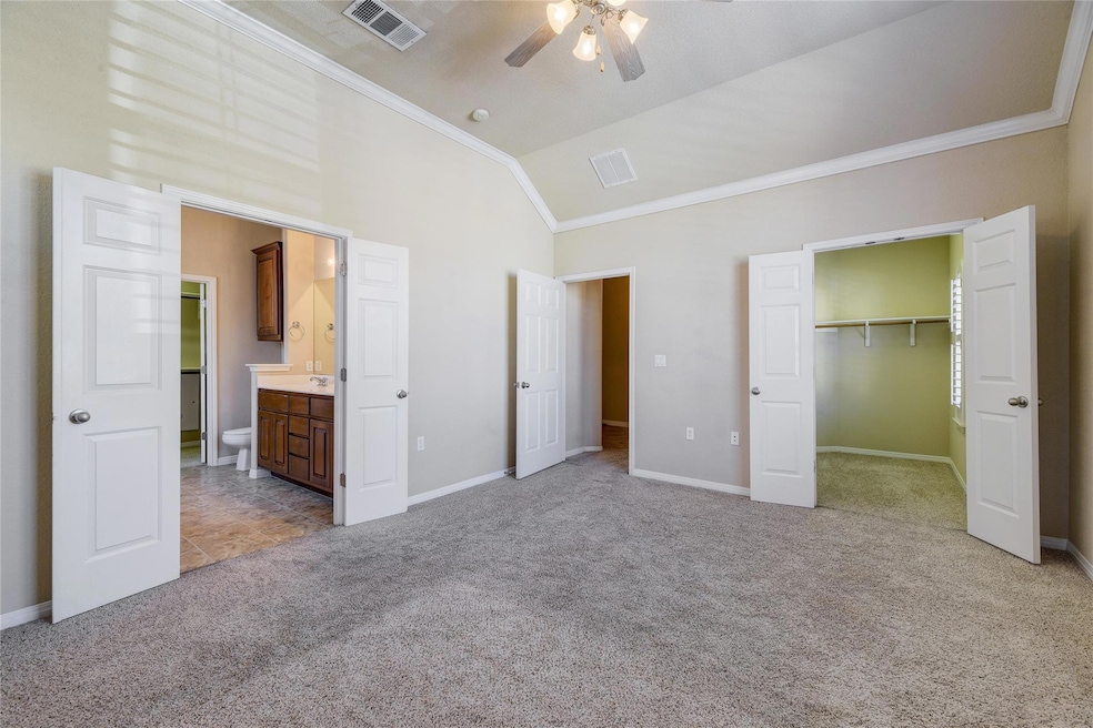 Unfurnished bedroom featuring ornamental molding,