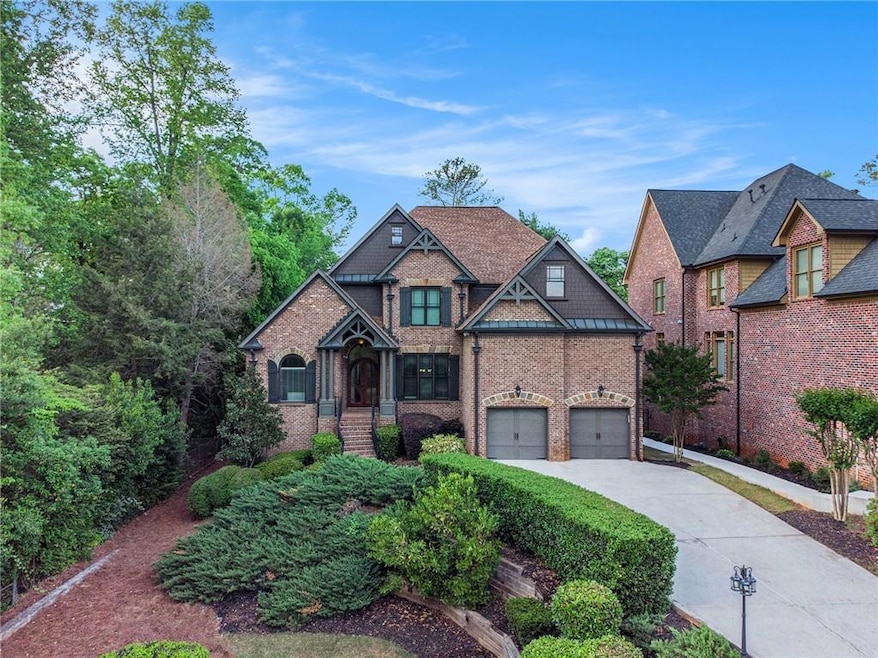 Craftsman house with driveway and brick siding