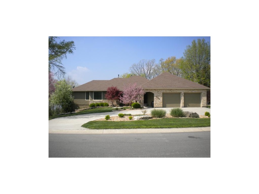 Front of Home with Circle Drive and Beautiful Land