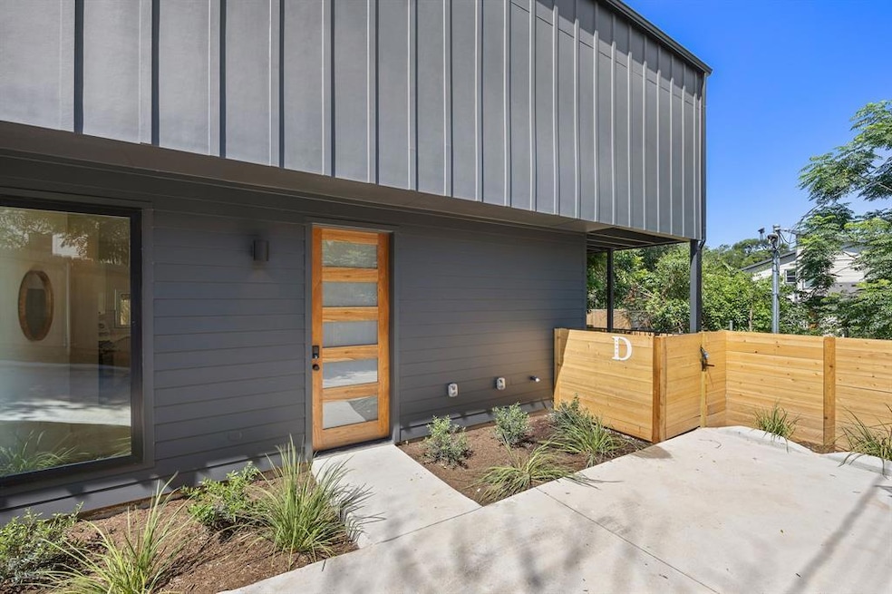 Doorway to property with board and batten siding 