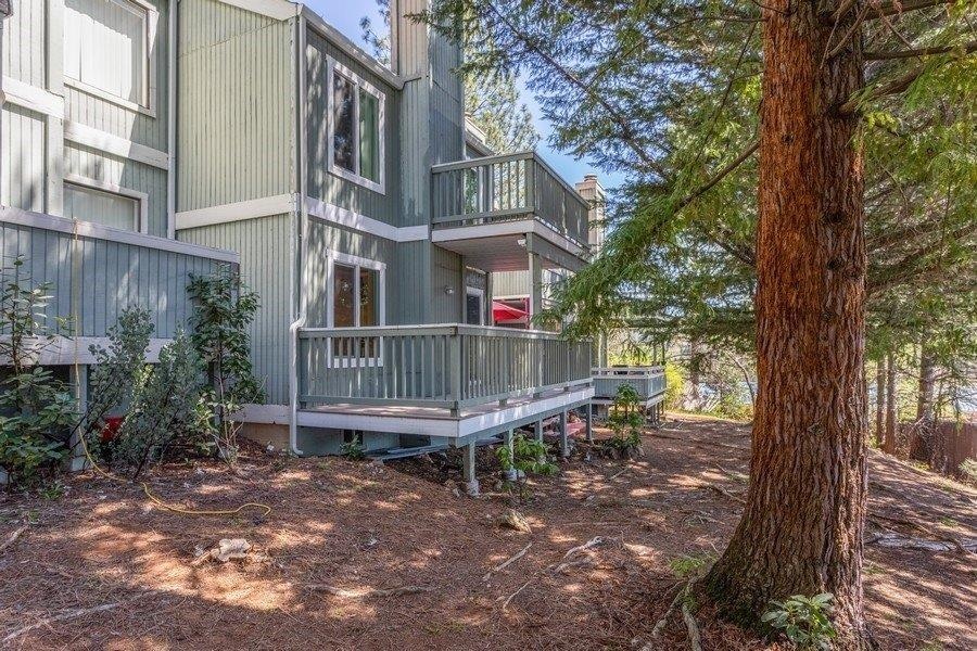 Rear of home.  All decking has been replaced/updated, as well as the windows.