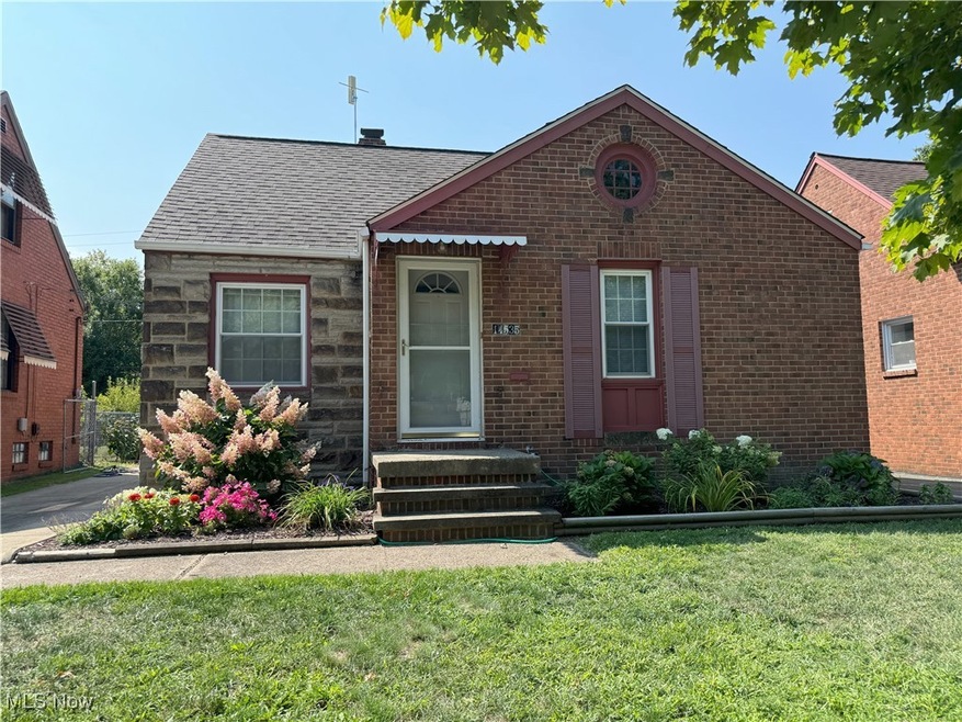 View of front of house with a front yard