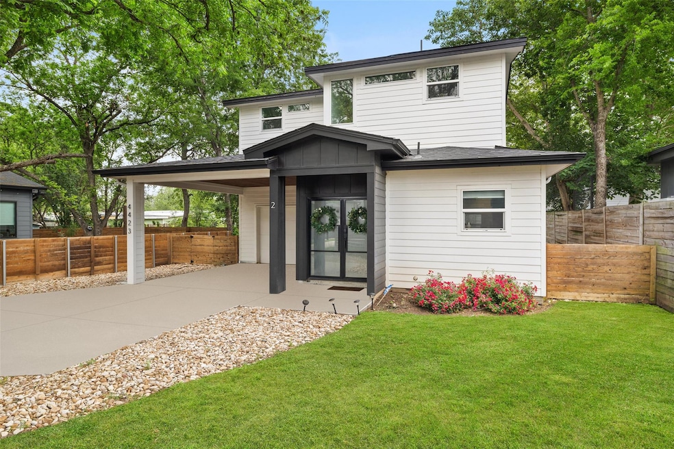 View of front of house featuring concrete drivewa