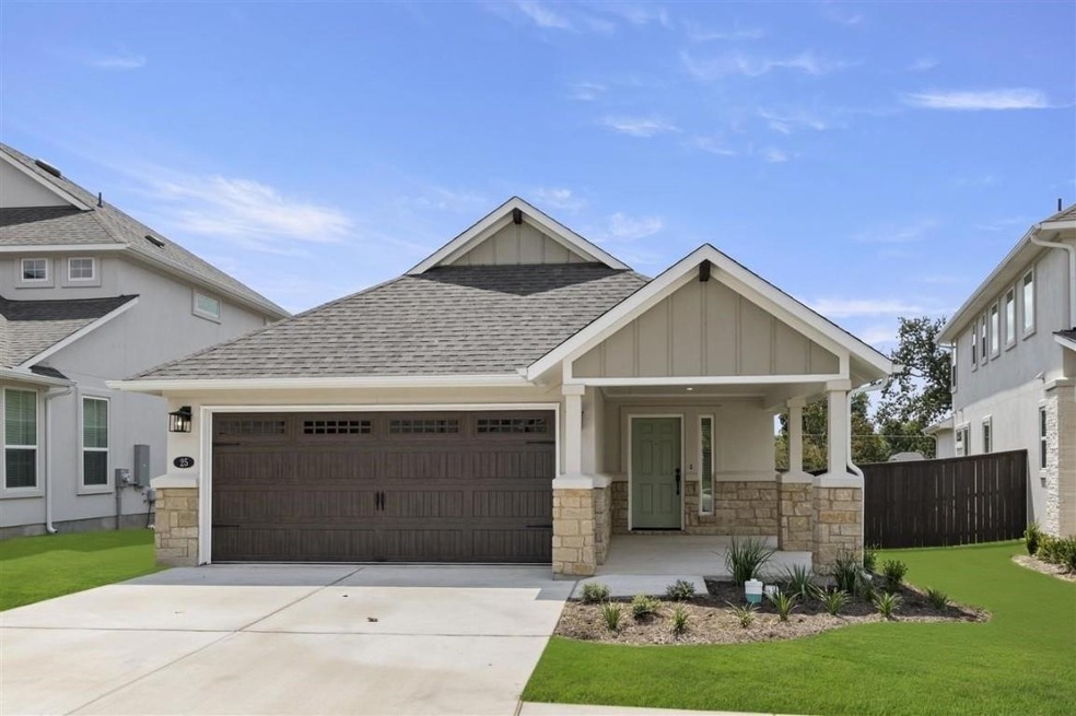 Craftsman inspired home with a garage, stone sidi