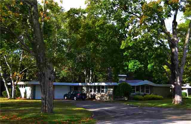 Large, separately-owned corner lot to left of hous