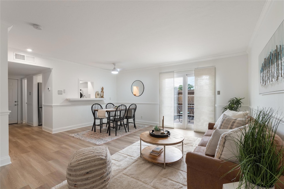 Living room with light wood-style floors, ceiling