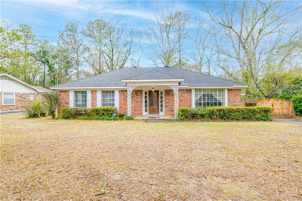Single story home featuring a front lawn