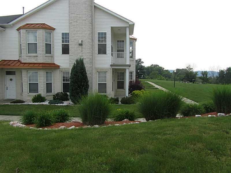 Exterior Front. Front of unit, backs to large, pri