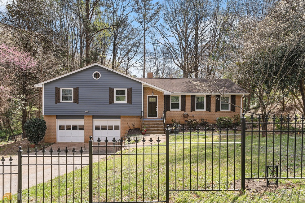 Great curb appeal with custom wood shutters, new w