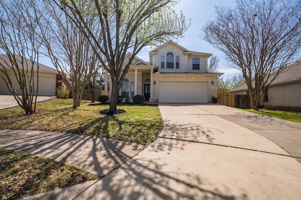 Traditional-style house featuring concrete drivew