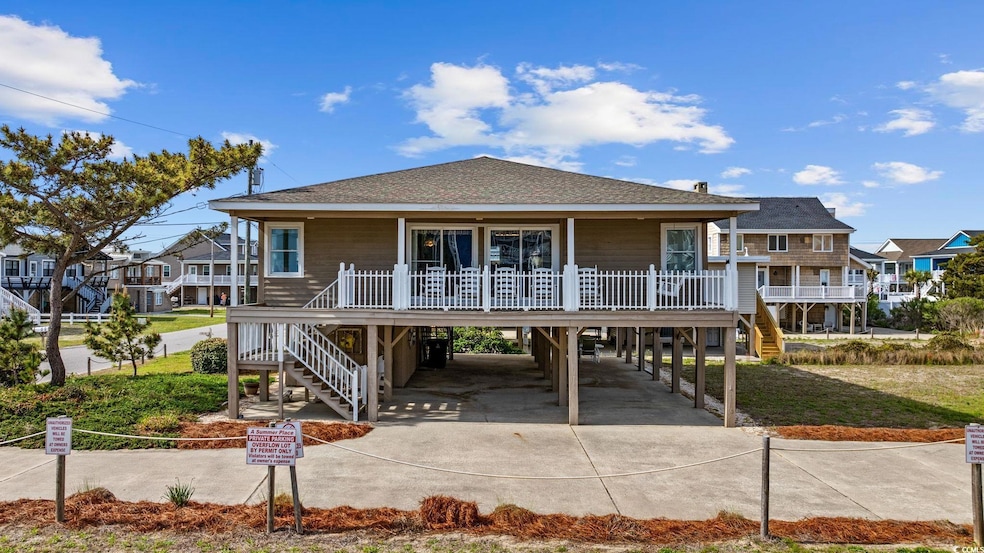View of front of home featuring stairs, concrete d
