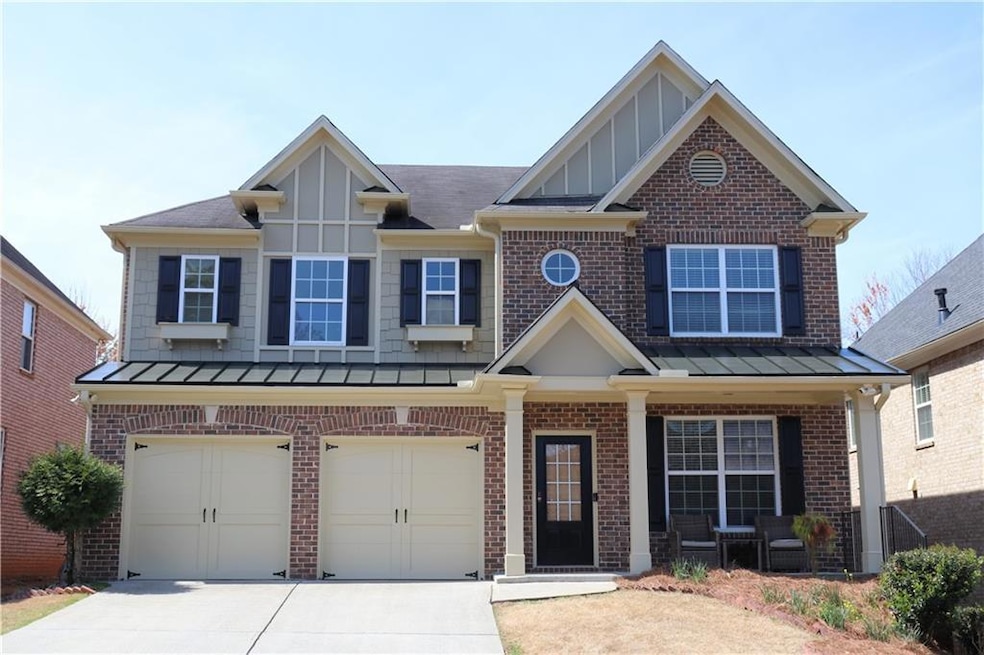 View of front of property featuring a garage