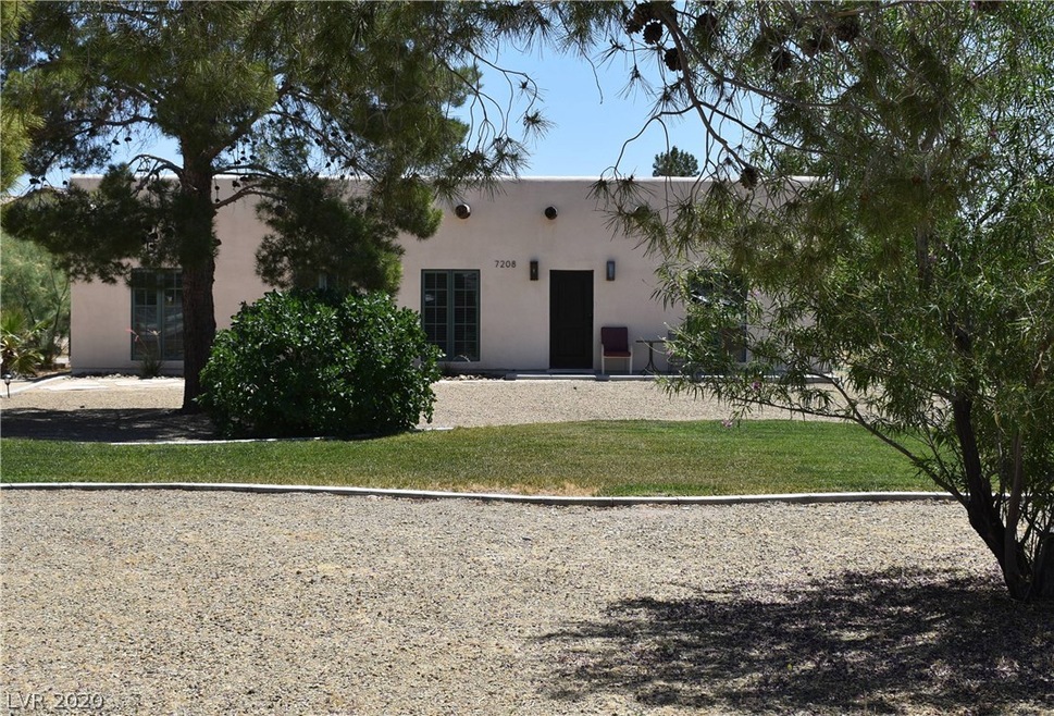 Beautiful Adobe style home with plenty of front ya