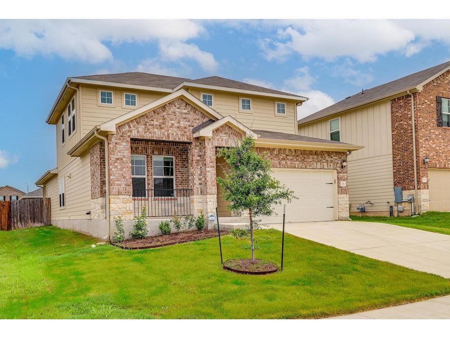 View of front of property with a garage, driveway