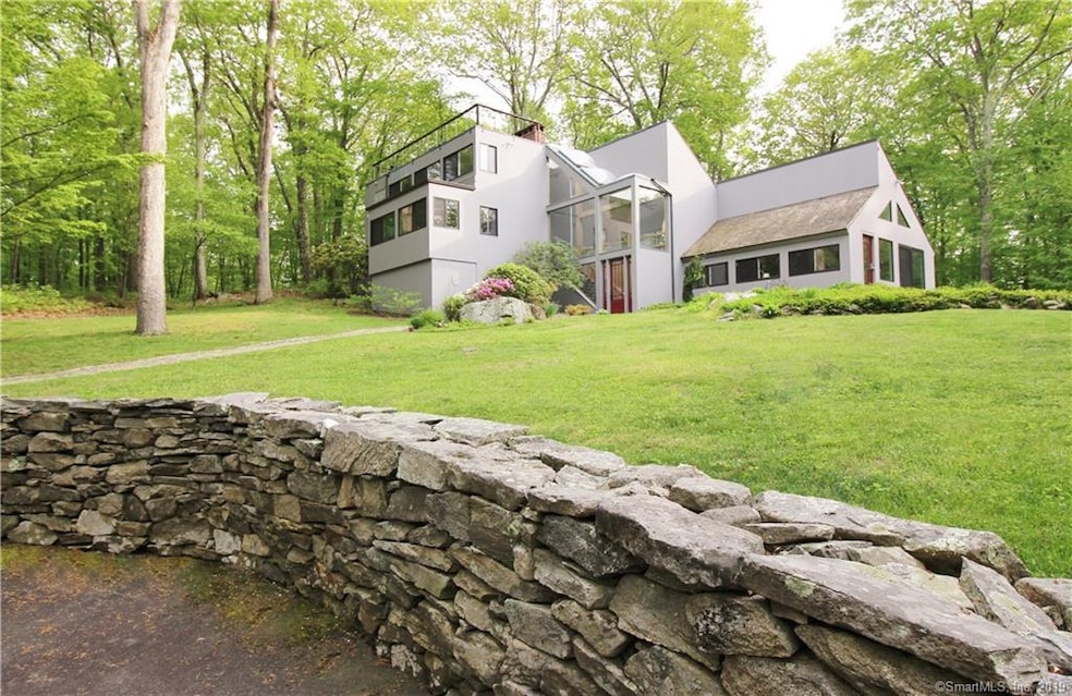 Early summer view of this very inviting home in a 