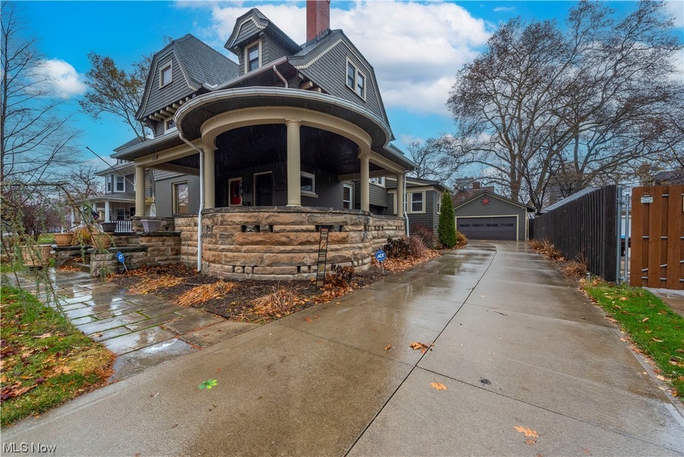 View of front of house with stone wrap around porch new concrete drive way and stone walk ways