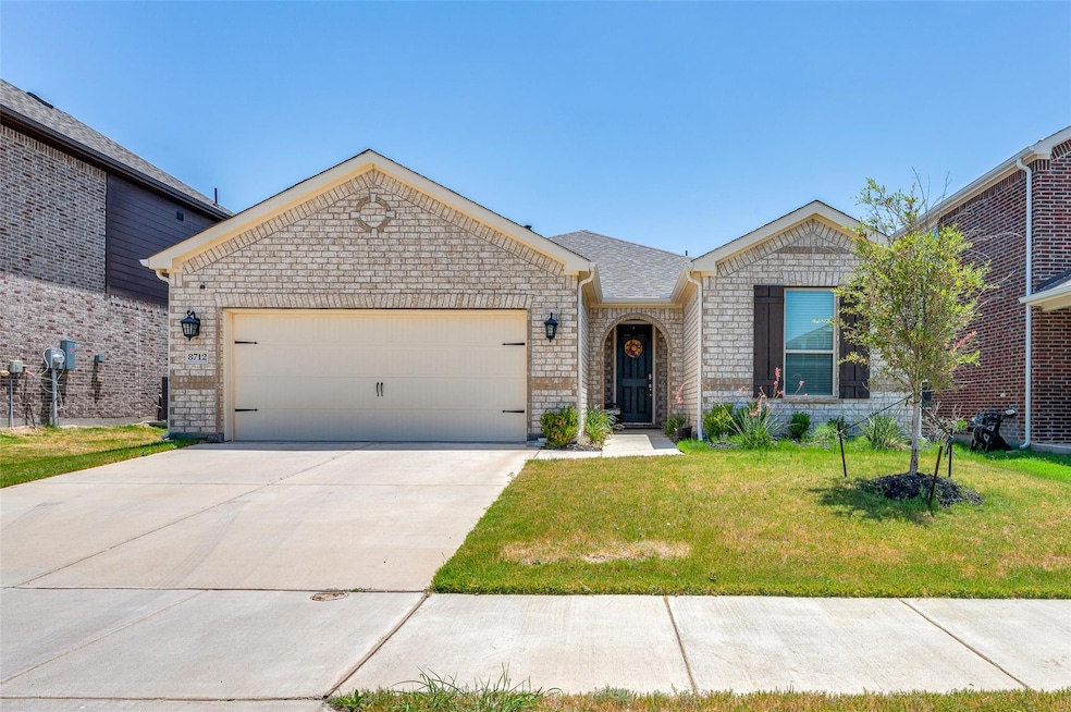 View of front of house featuring a garage and a fr