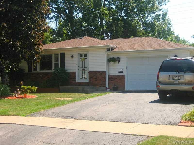 Exterior Front. An attractive brick and frame ranc