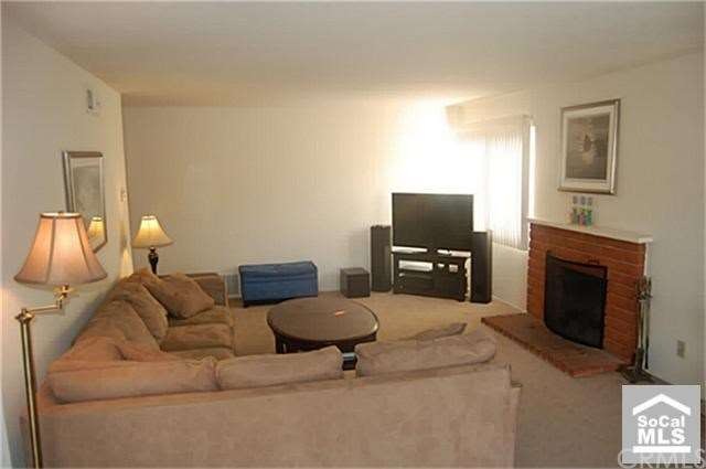 Spacious living room with a cozy gas and wood burn