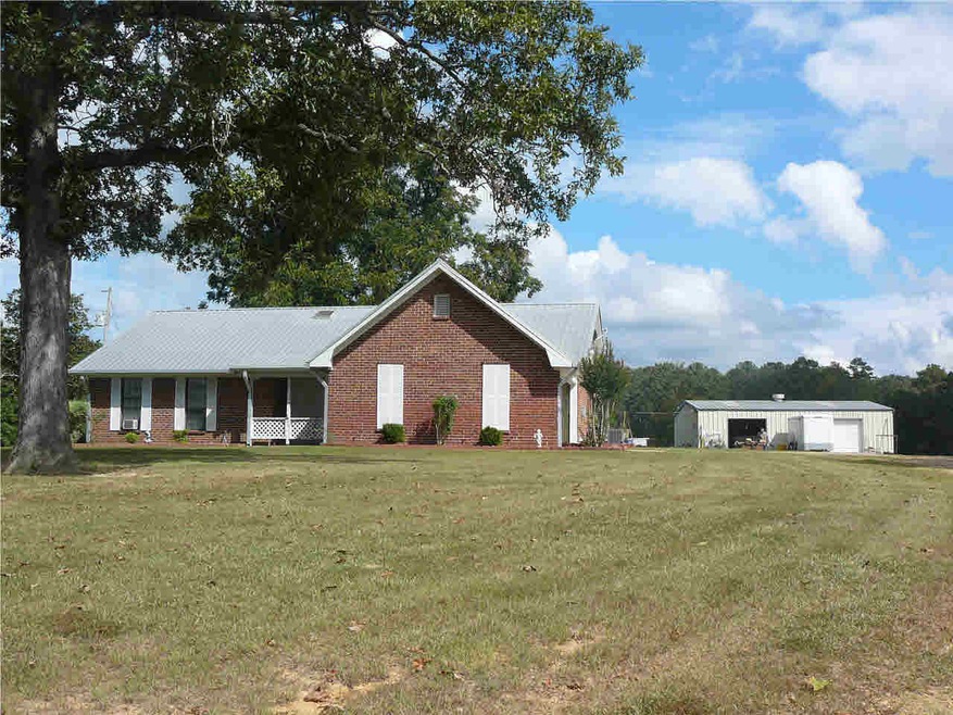 Front of Home and shop from White Rd